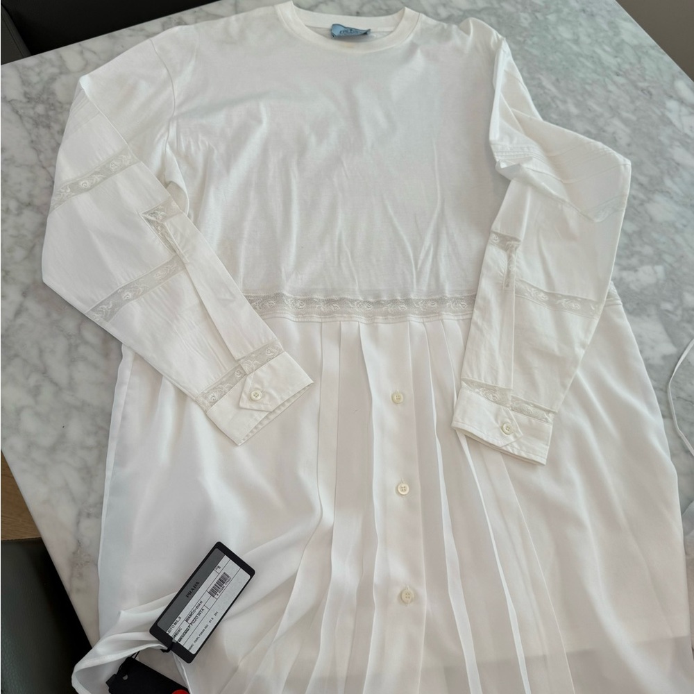 Prada shirt dress size small runs wide  . Brand new with tags!